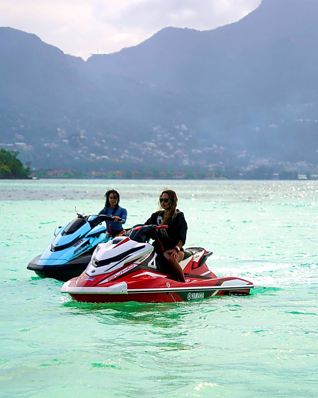 Two guests riding a Yamaha jetski in Seychelles